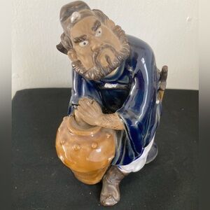 Ceramic “Mud Man” Figurine with Blue and Brown Accents